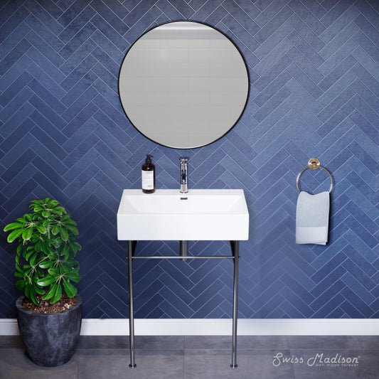 White ceramic console sink with chrome legs and wall-mounted faucet, modern bathroom vanity setup.