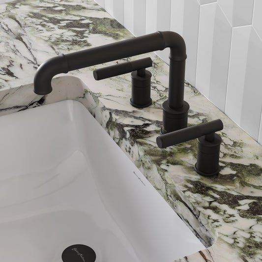 Widespread bathroom faucet in matte black with sleek handles, mounted on marble countertop.