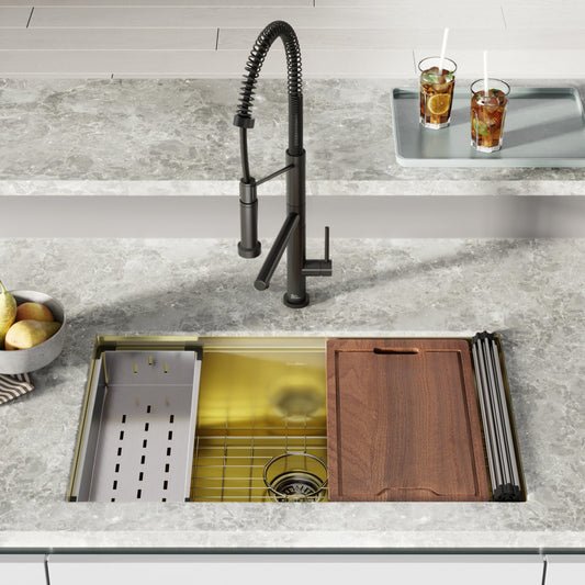 32-inch undermount workstation kitchen sink in polished gold stainless steel with wood cutting board and drain rack.