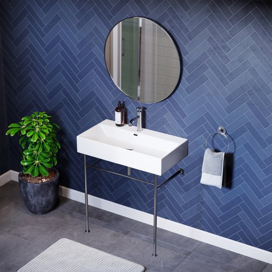 White ceramic console sink with chrome legs, rectangular basin, single faucet hole.